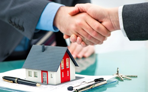Professionals discussing a property opportunity